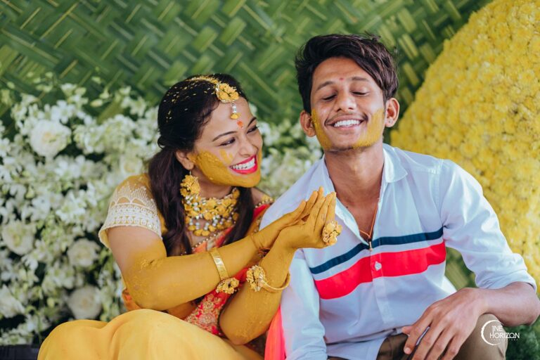 Candid picture of the bride and her brother enjoying the Haldi Ceremony