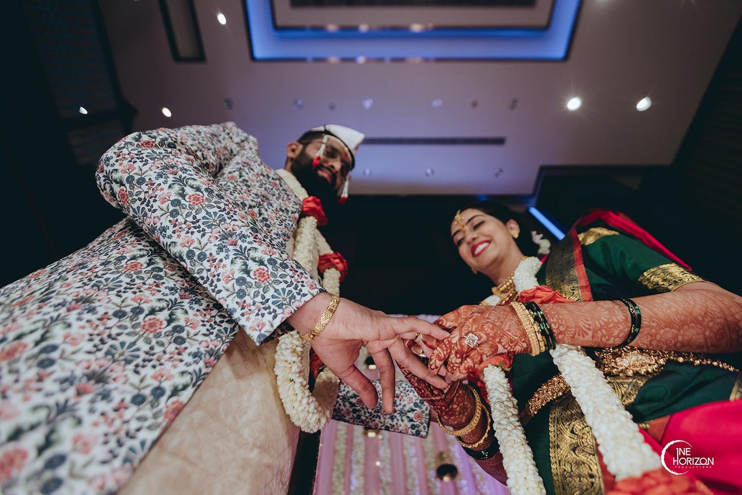 An upshot of Priyanka and Kunal during their engagement ceremony by Wedding Photographers in Bangalore