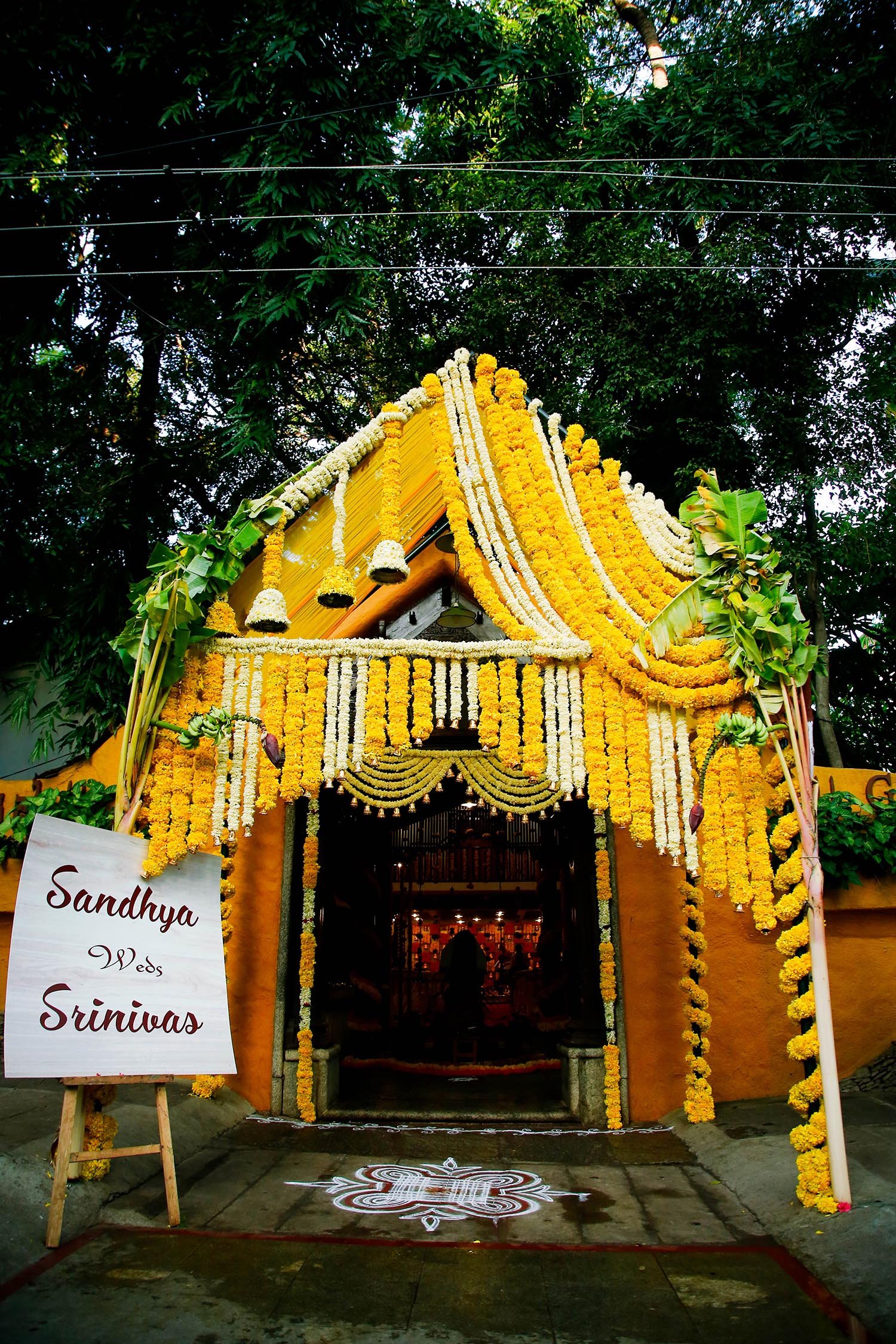 Entrance of Ganjam Mantapa Bangalore decorated with white and yellow flower garlands