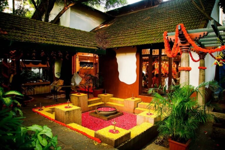 Picturesque decoration of space in Ganjam Kalyana Mantapa with yellow and orange flower petals