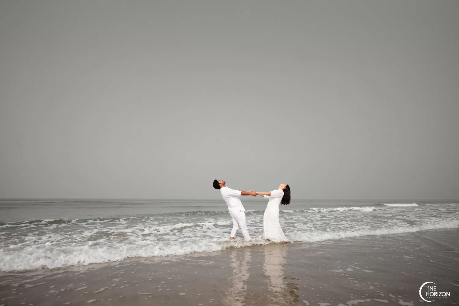 Its beautiful out here. Full length shot of an affectionate young couple  taking in the beach views while standing on a jetty Stock Photo - Alamy